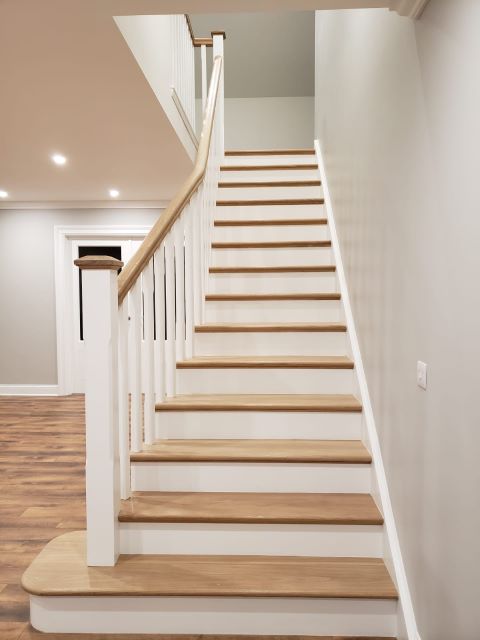 White Oak and Red Deal Flared Cut String Stairs